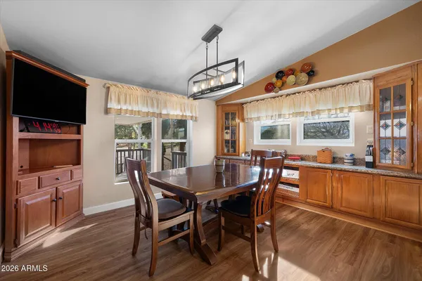a view of a dining room with furniture window and wooden floor