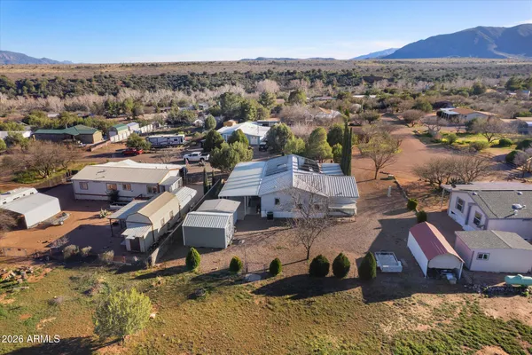 an aerial view of residential houses with outdoor space