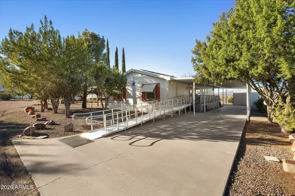 a view of a building with large tree