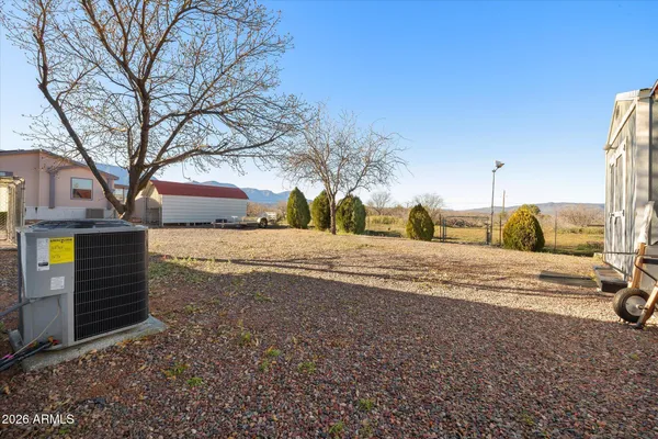 a view of road with large trees