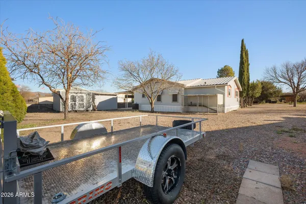 a blue and white house with outdoor space