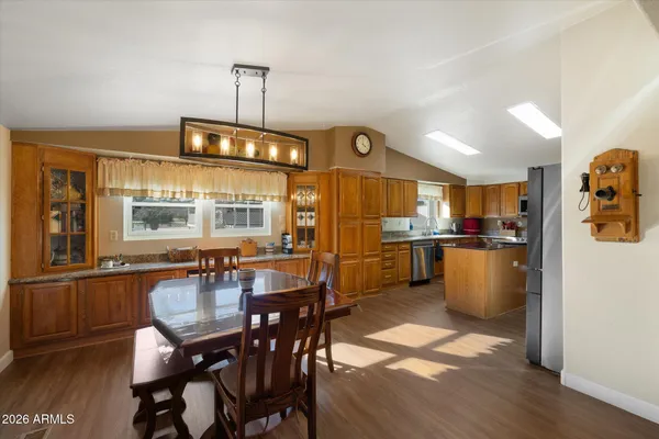 a kitchen with sink and refrigerator