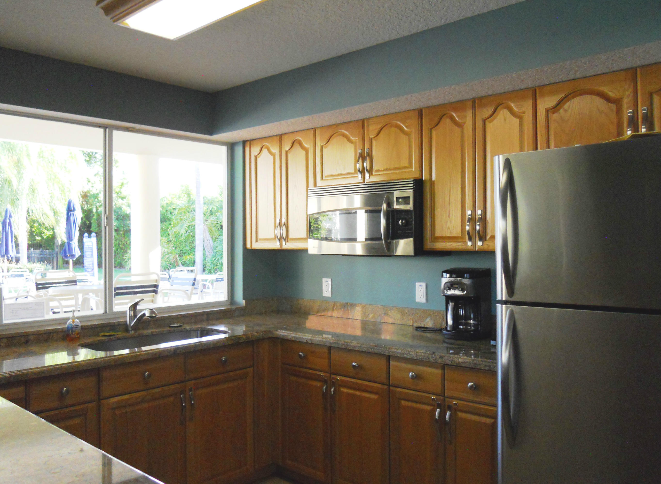 340 Northwest 67th Street, Unit 101 Boca Raton, FL 33487 - Photo 18 of 26 Clubhouse Kitchen