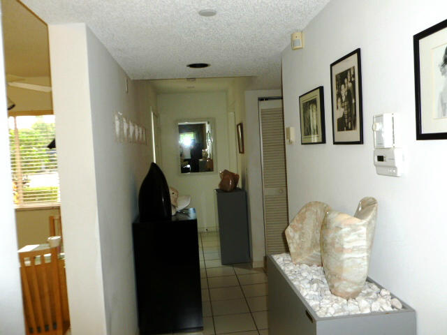 340 Northwest 67th Street, Unit 101 Boca Raton, FL 33487 - Photo 3 of 26 Hallway