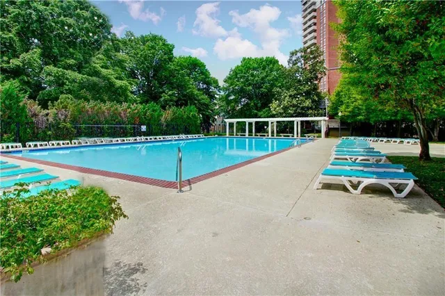 a view of a backyard with sitting area