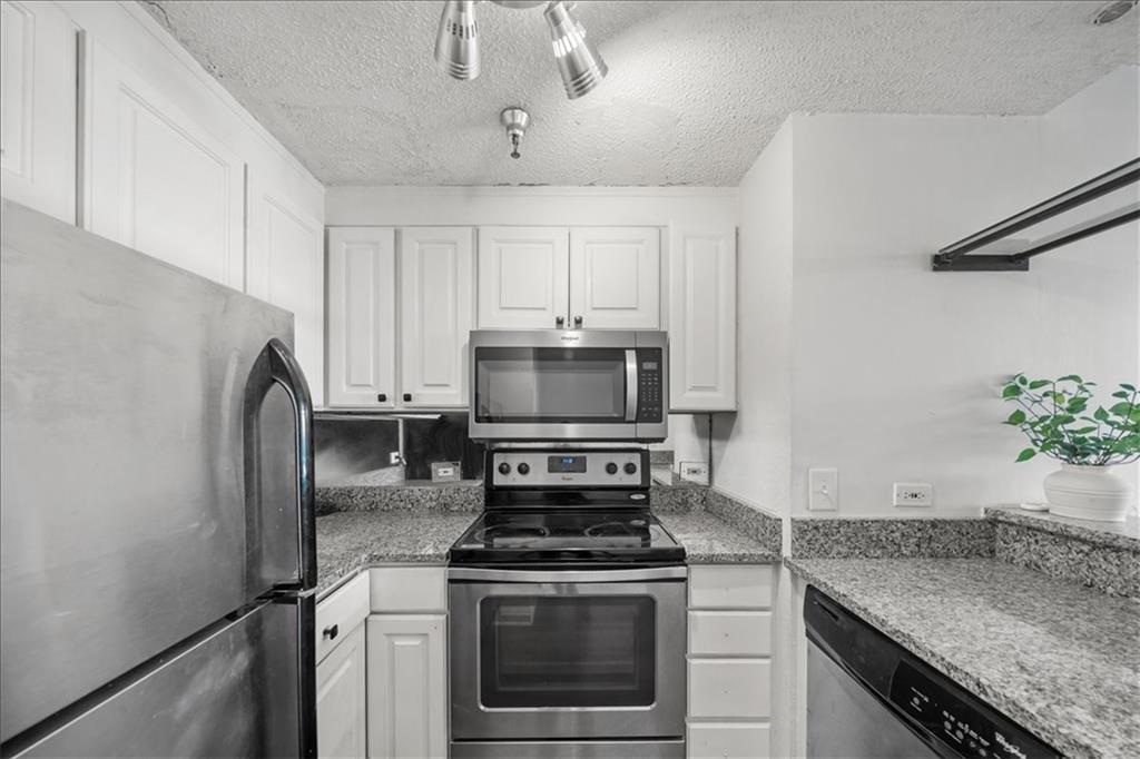 375 Ralph McGill Boulevard Northeast, Unit 407 Atlanta, GA 30312 - Photo 3 of 22 a kitchen with granite countertop a stove sink and refrigerator