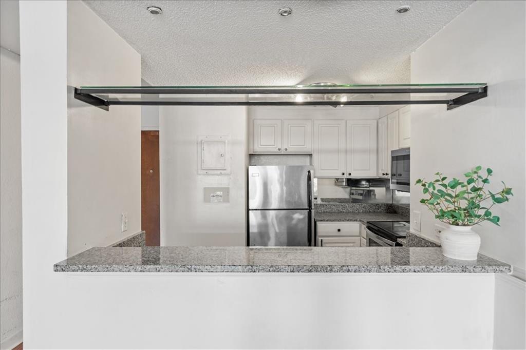 375 Ralph McGill Boulevard Northeast, Unit 407 Atlanta, GA 30312 - Photo 5 of 22 a kitchen with a refrigerator and a sink