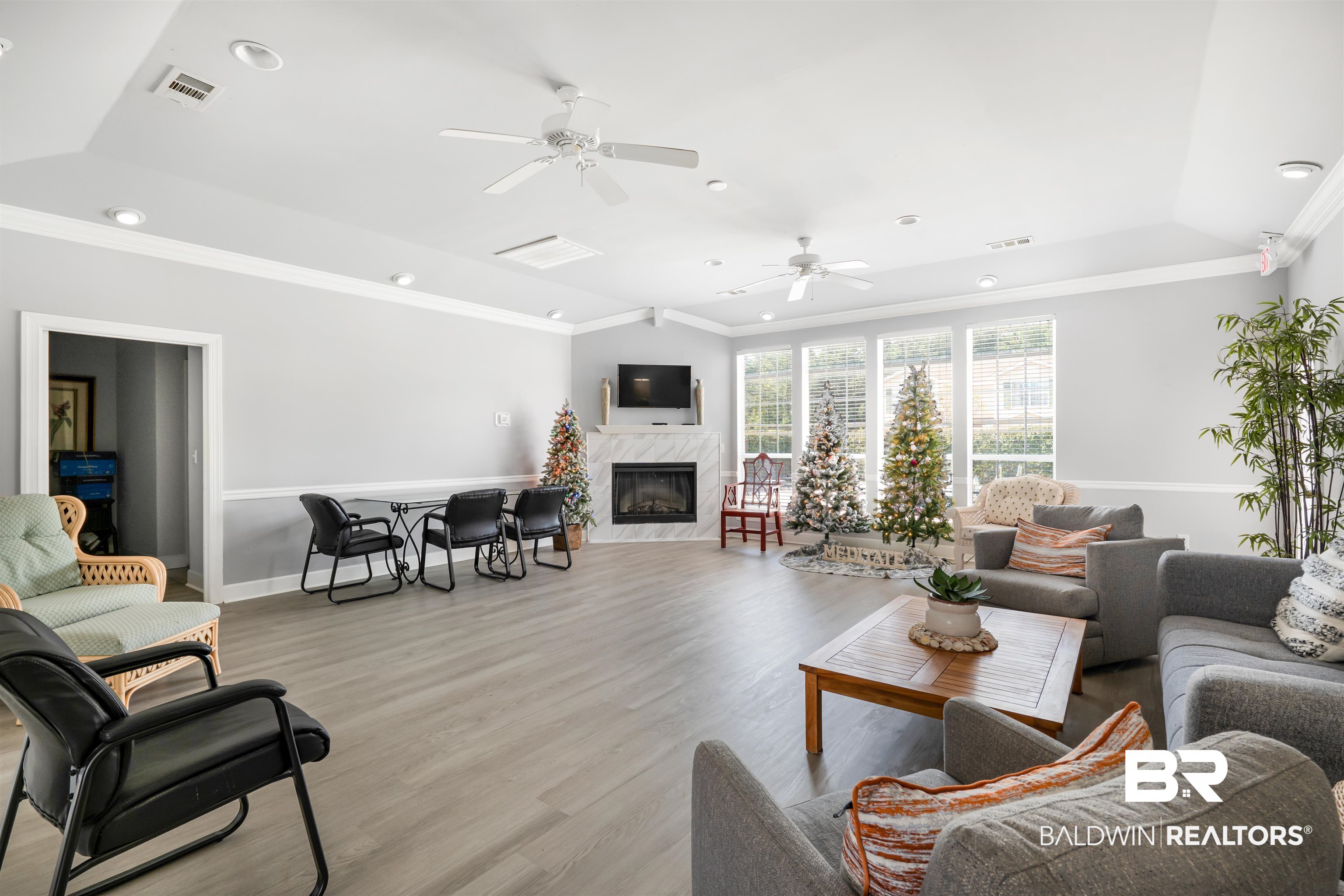 1517 Regency Road, Unit 68 Gulf Shores, AL 36542 - Photo 38 of 43 Living room with ceiling fan, crown molding, and light hardwood / wood-style flooring