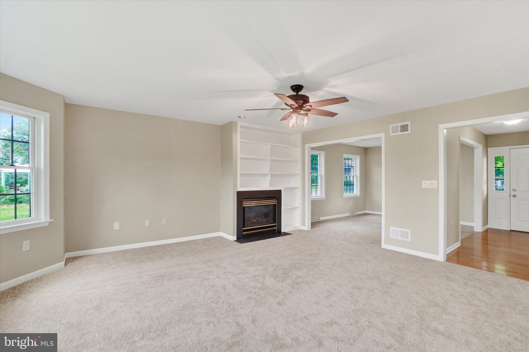 105 Margate Road York, PA 17408 - Photo 8 of 43 a view of a livingroom with a fireplace and window