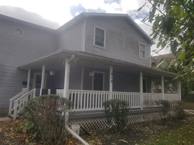 a front view of a house with stairs