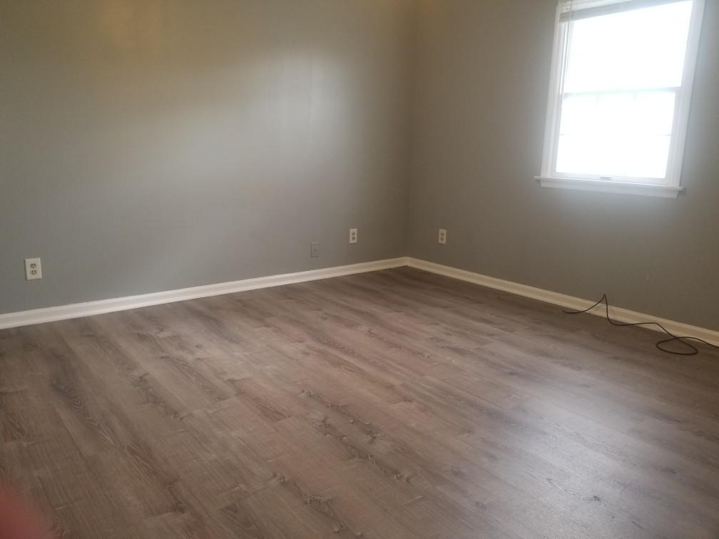 918 6th Street, Unit 3 LaSalle, IL 61301 - Photo 6 of 7 an empty room with wooden floor and windows
