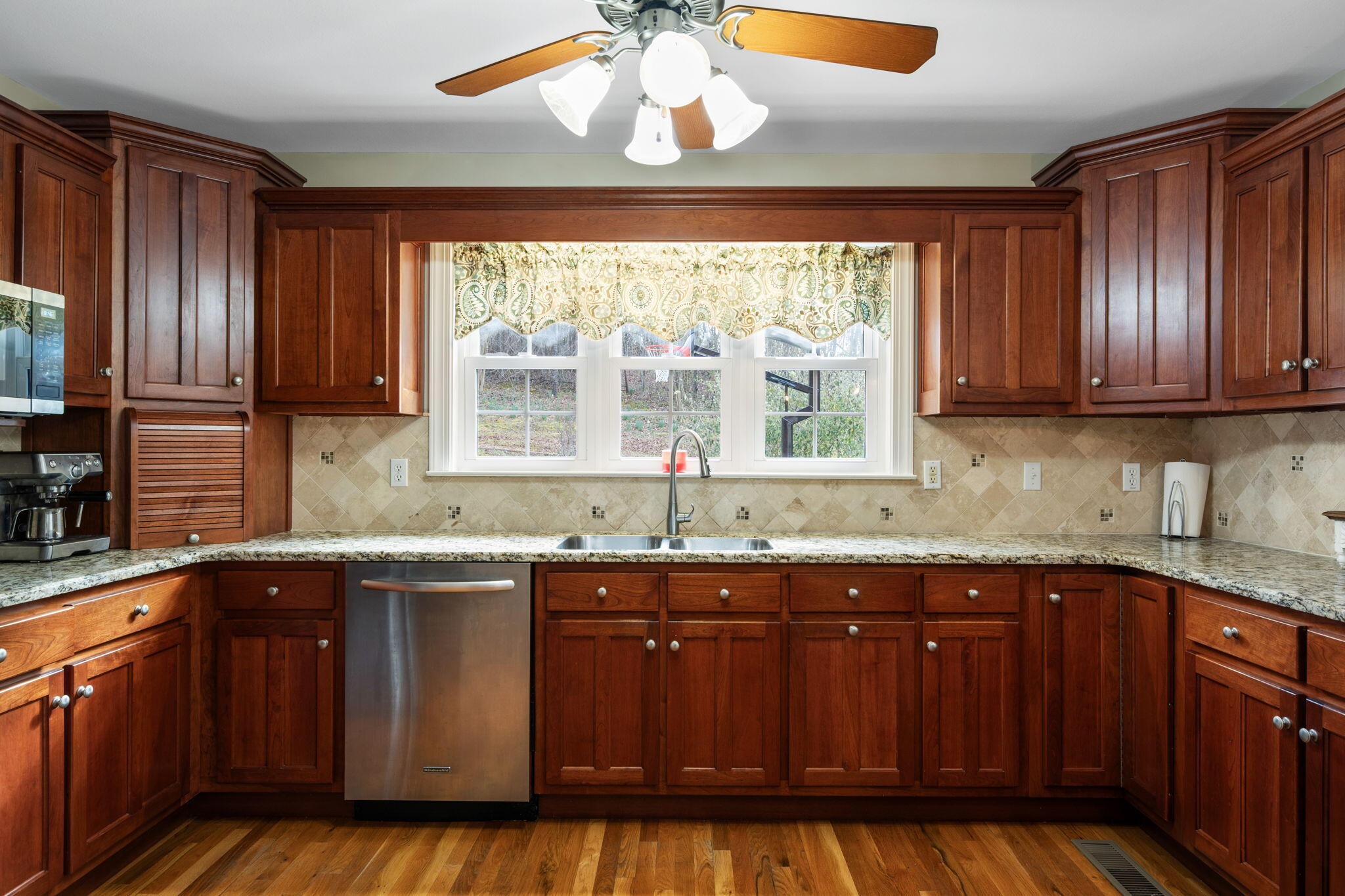 153 Nix Road Dunlap, TN 37327 - Photo 12 of 61 a kitchen with stainless steel appliances granite countertop wooden cabinets a sink and dishwasher with wooden floor