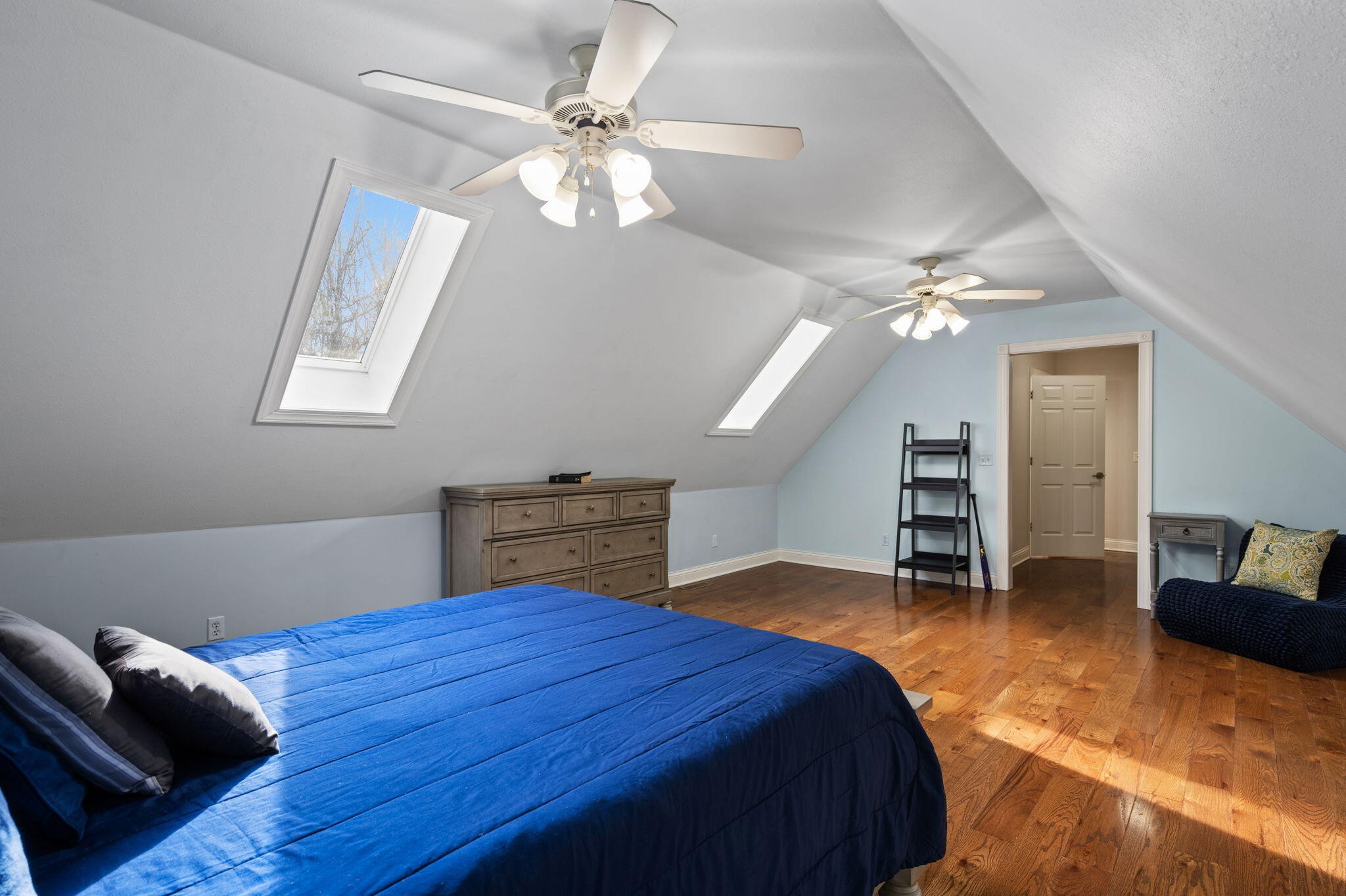 153 Nix Road Dunlap, TN 37327 - Photo 35 of 61 a bedroom with a bed and a chandelier