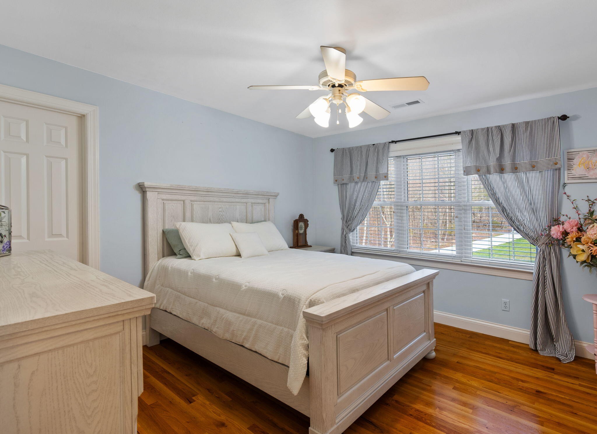153 Nix Road Dunlap, TN 37327 - Photo 37 of 61 a bedroom with a bed and a chandelier