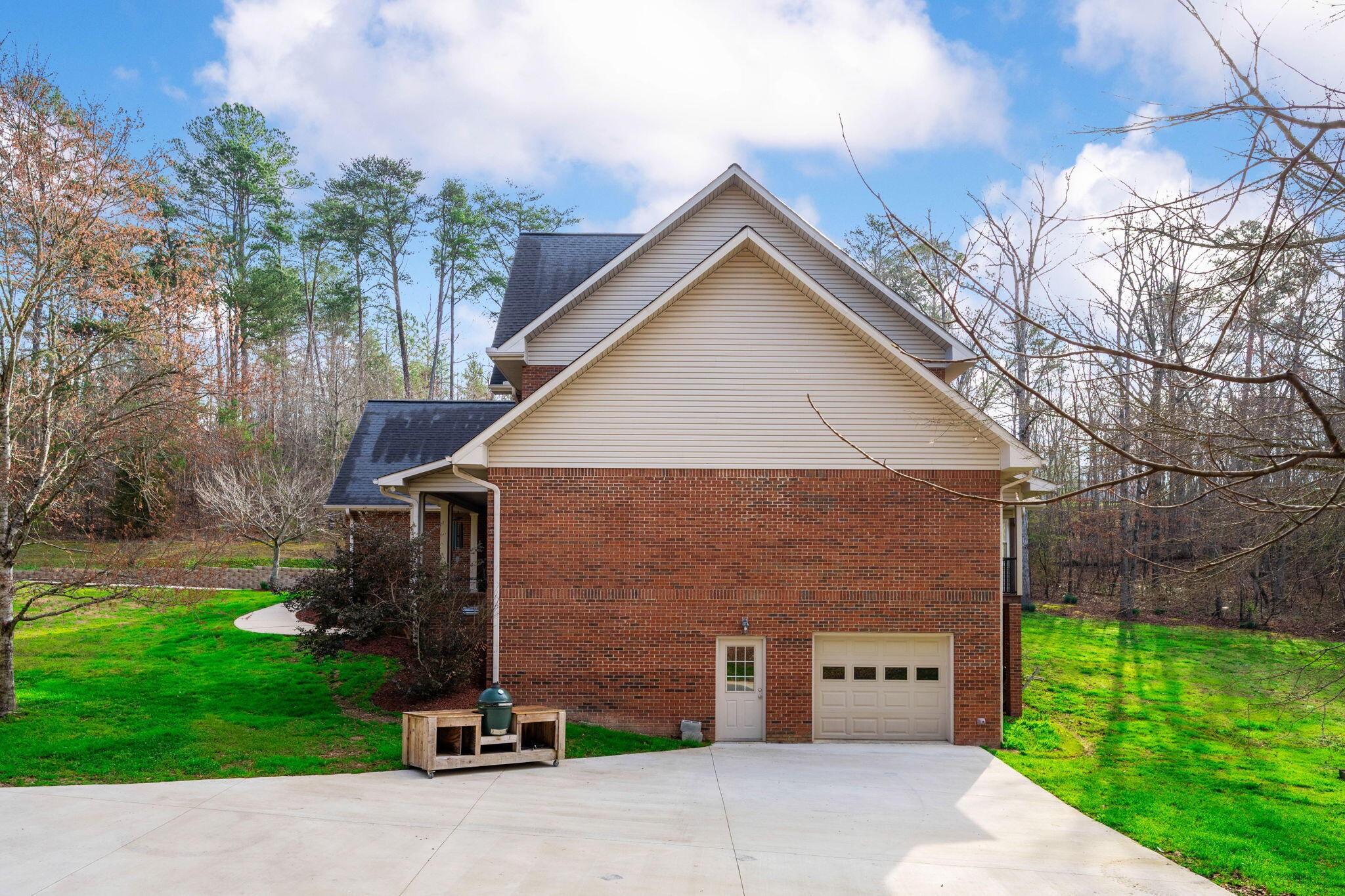 153 Nix Road Dunlap, TN 37327 - Photo 57 of 61 a front view of a house with a yard and garage