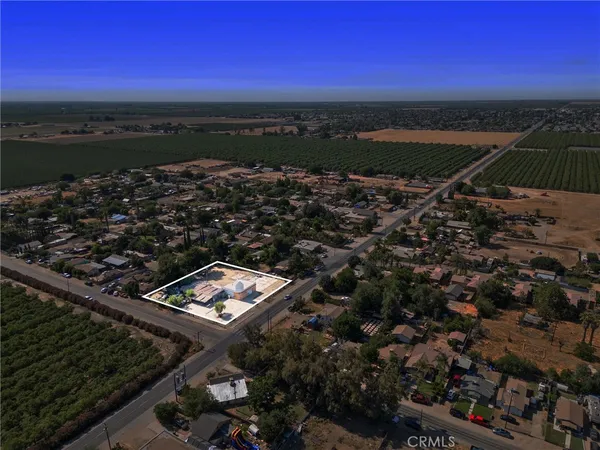 a view of a city street next to a yard