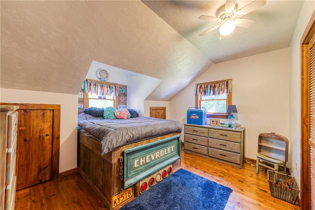 321 Westminster Road Sarver, PA 16055 - Photo 17 of 25 a bed room with a bed and a dresser