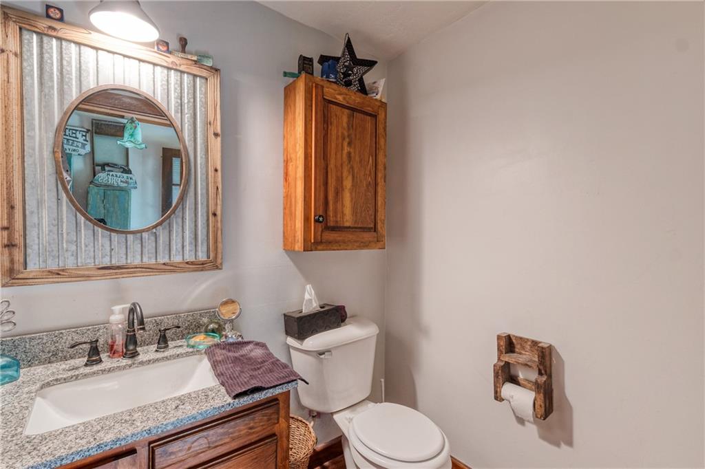 321 Westminster Road Sarver, PA 16055 - Photo 18 of 25 a bathroom with a toilet sink vanity and mirror
