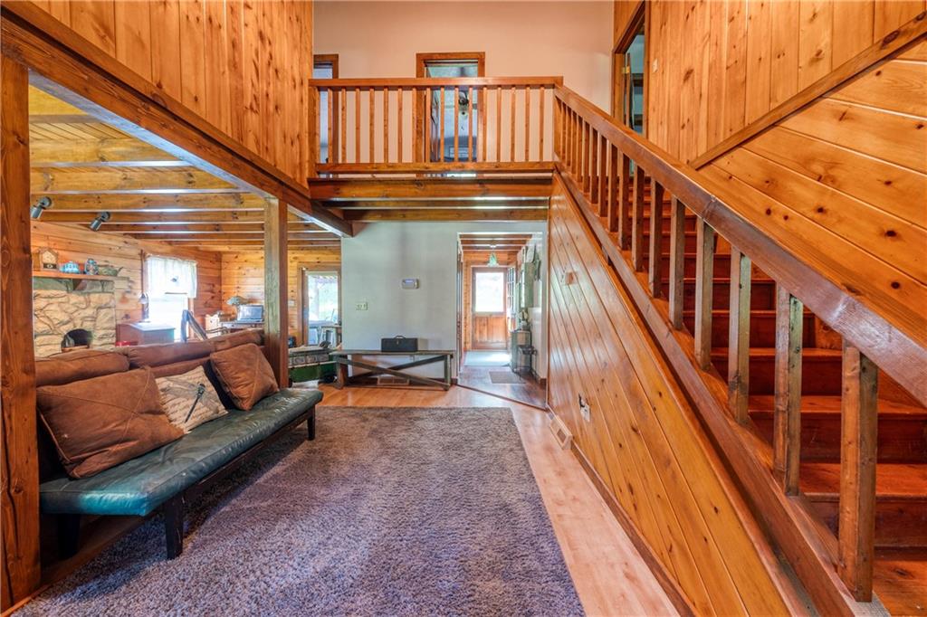321 Westminster Road Sarver, PA 16055 - Photo 5 of 25 a view of staircase with wooden floor and book shelf