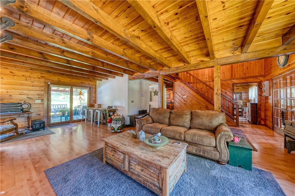 321 Westminster Road Sarver, PA 16055 - Photo 6 of 25 a living room with furniture and a dining table with wooden floor