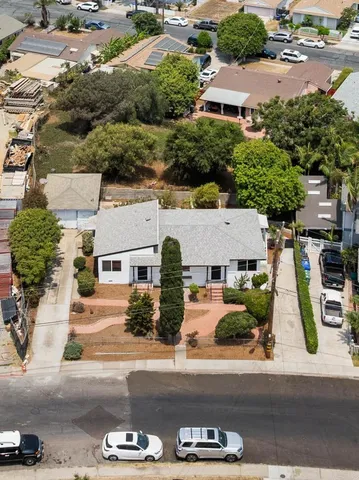 an aerial view of residential houses and outdoor space