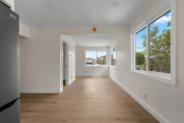 a view of an empty room with a window