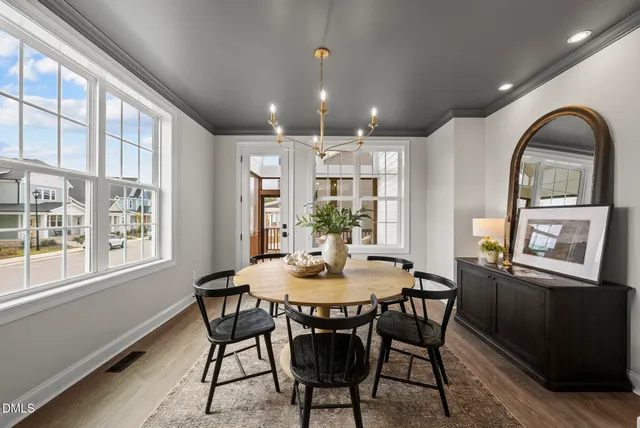 a room with gym equipment and large mirror