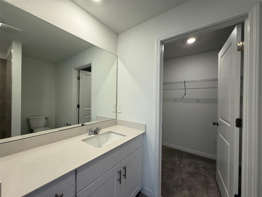 11795 Cloverly Lane Punta Gorda, FL 33955 - Photo 20 of 36 a bathroom with a sink and a mirror