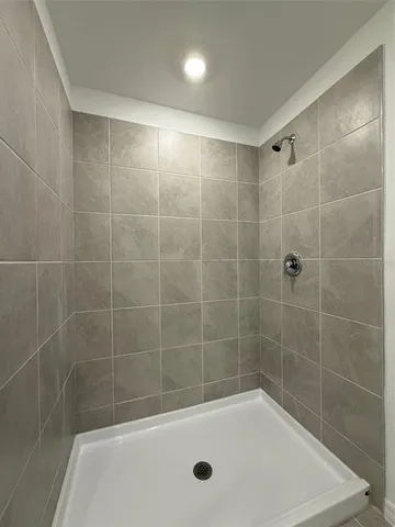 a bath tub sitting next to a shower