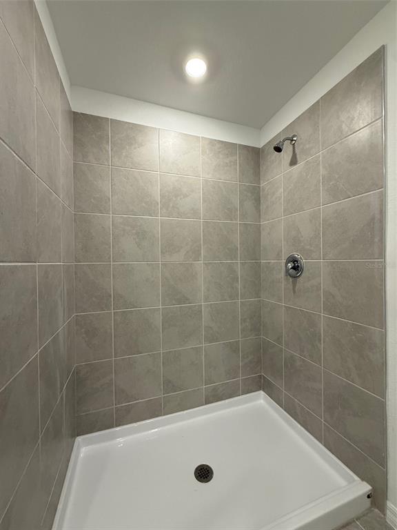 11795 Cloverly Lane Punta Gorda, FL 33955 - Photo 21 of 36 a bath tub sitting next to a shower