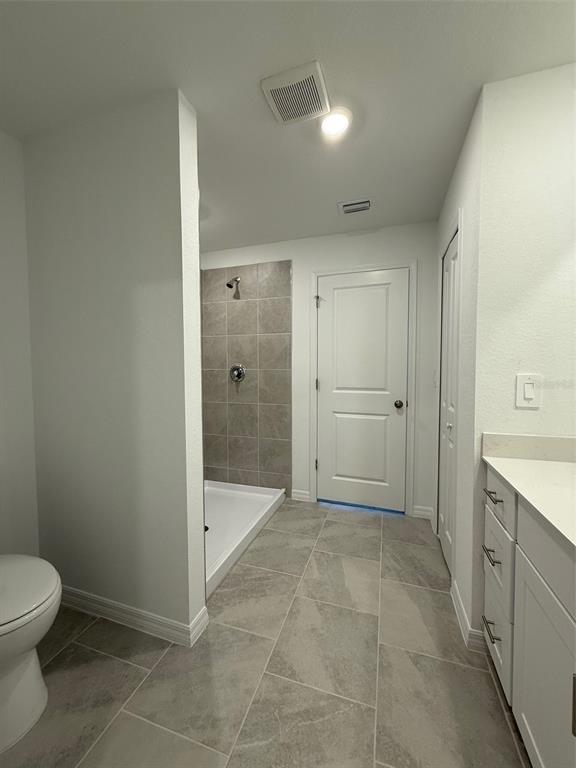 11795 Cloverly Lane Punta Gorda, FL 33955 - Photo 23 of 36 a bathroom with a shower and a toilet