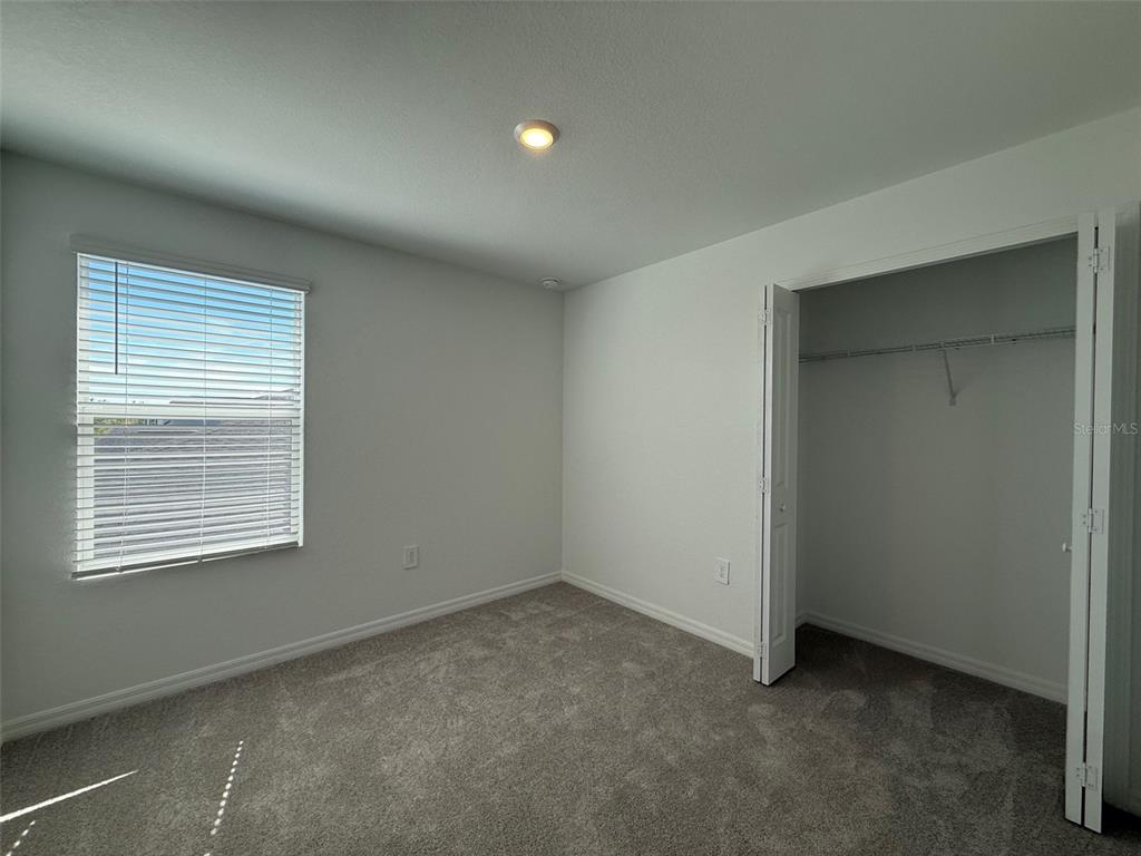 11795 Cloverly Lane Punta Gorda, FL 33955 - Photo 25 of 36 an empty room with a window