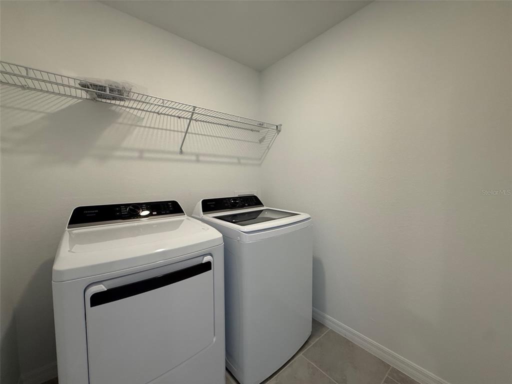 11795 Cloverly Lane Punta Gorda, FL 33955 - Photo 26 of 36 a utility room with dryer and washer