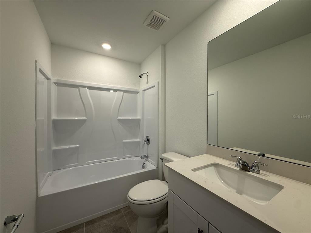 11795 Cloverly Lane Punta Gorda, FL 33955 - Photo 28 of 36 a bathroom with a sink toilet and shower