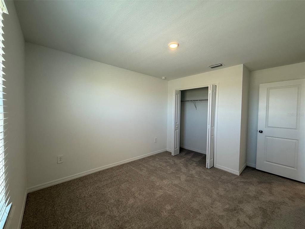 11795 Cloverly Lane Punta Gorda, FL 33955 - Photo 29 of 36 an empty room with closet