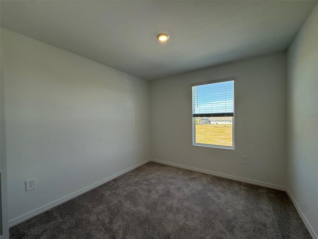 11795 Cloverly Lane Punta Gorda, FL 33955 - Photo 31 of 36 an empty room with a window