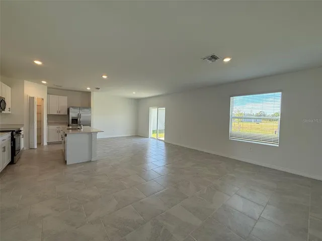 a view of kitchen and windows