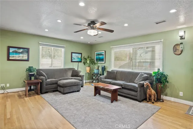 a bathroom with a granite countertop sink a shower and a mirror