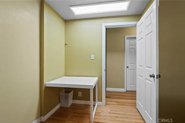 a front view of a house with patio and garden