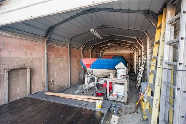 a utility room with stainless steel appliances and cabinets