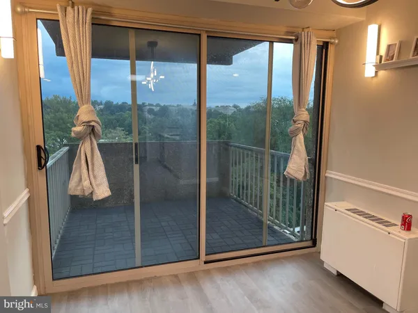 a view of a room with a large window