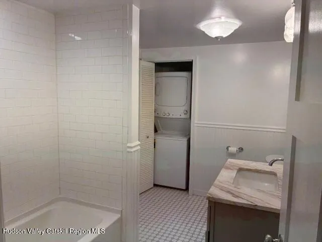 a bathroom with a sink and a shower