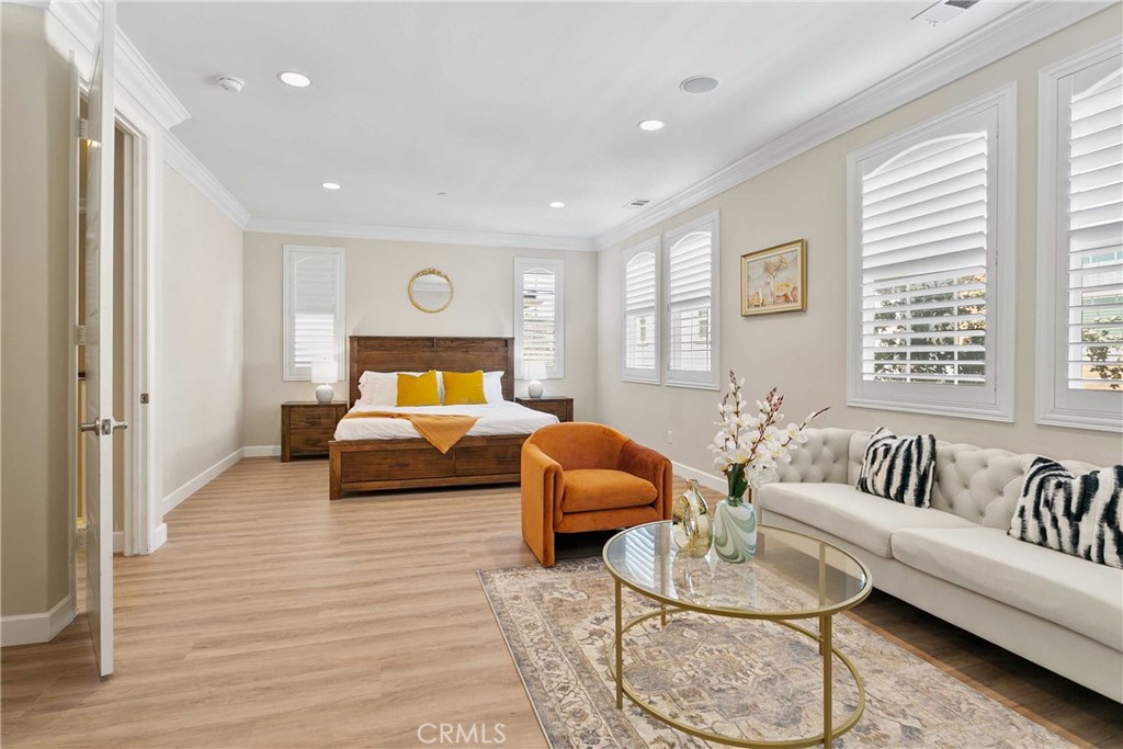 13078 Irisbend Avenue Eastvale, CA 92880 - Photo 14 of 23 a bedroom with furniture and a large window