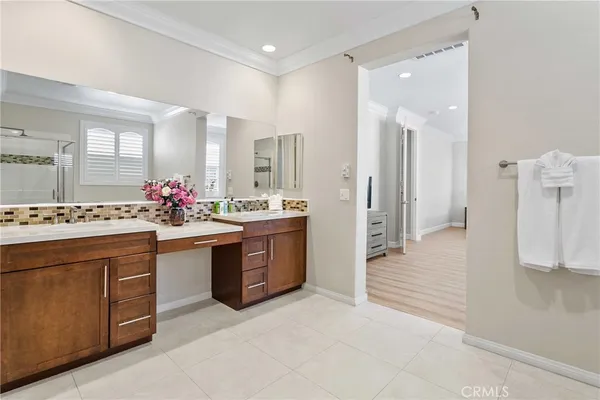 a spacious bathroom with a sink mirror and a shower
