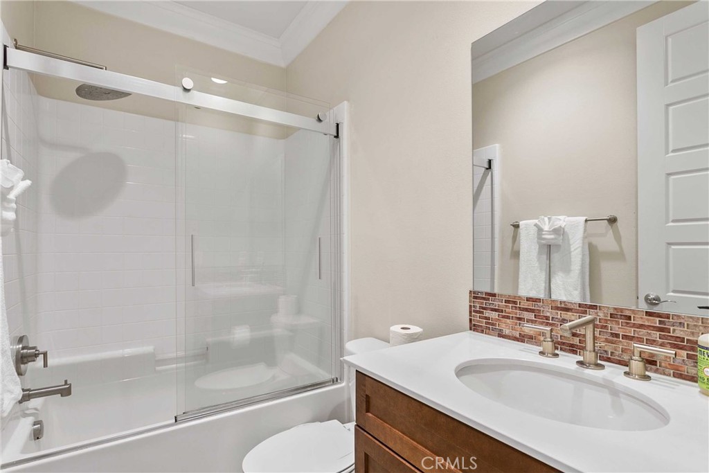 13078 Irisbend Avenue Eastvale, CA 92880 - Photo 18 of 23 a bathroom with a sink and a mirror