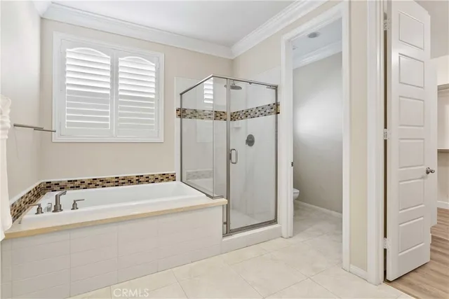 a bathroom with a tub and a window