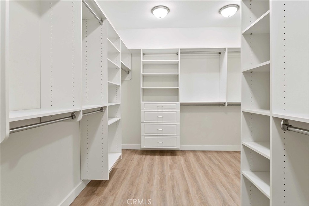 13078 Irisbend Avenue Eastvale, CA 92880 - Photo 21 of 23 a view of walk in closet with empty racks
