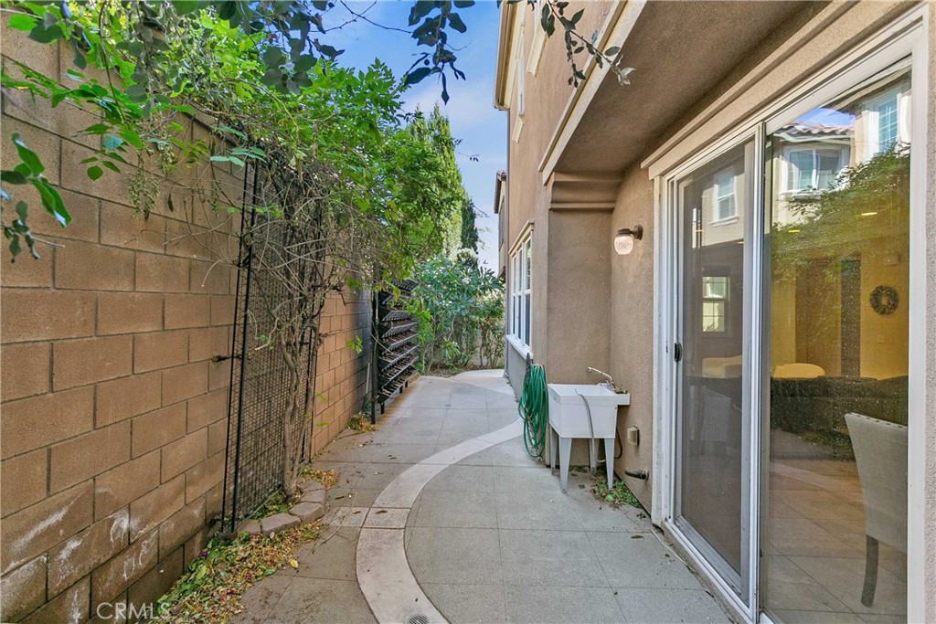 13078 Irisbend Avenue Eastvale, CA 92880 - Photo 23 of 23 a view of a porch with chairs and potted plants