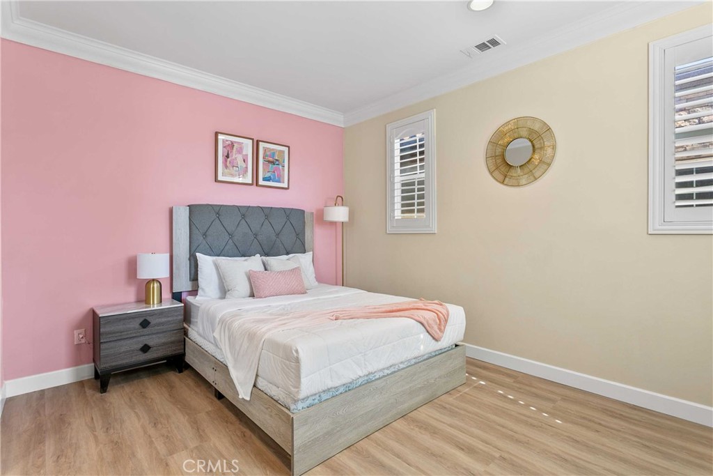 13078 Irisbend Avenue Eastvale, CA 92880 - Photo 10 of 23 a bedroom with a bed and a window