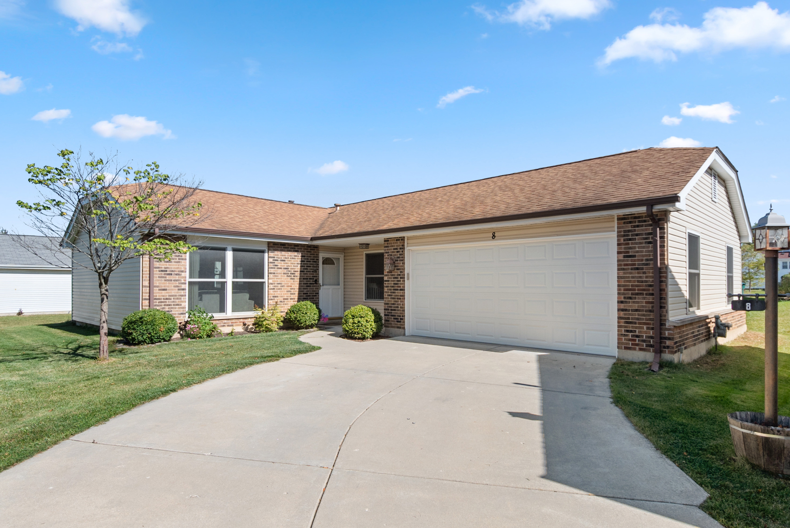 8 Warwick Court Streamwood, IL 60107 - Photo 1 of 14 a front view of a house with a yard and outdoor seating